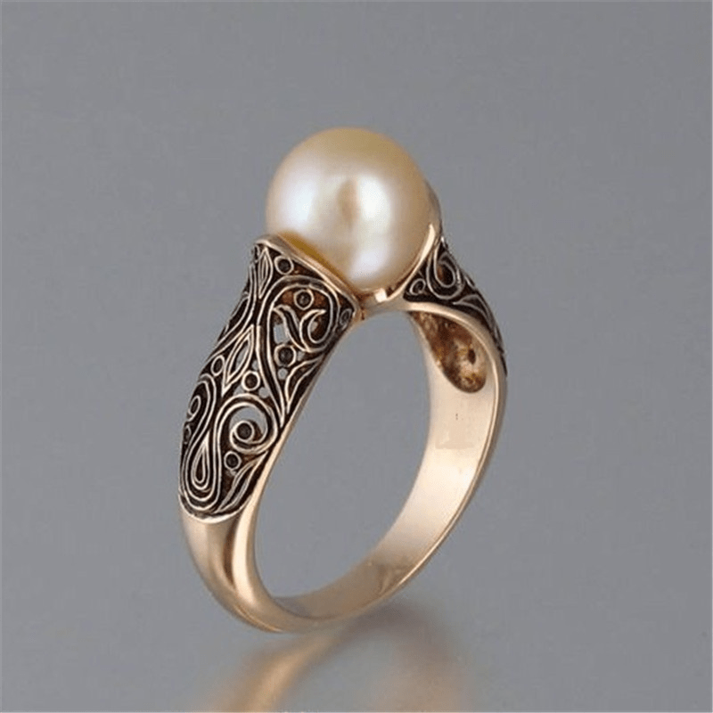 Anillo dorado vintage con perlas