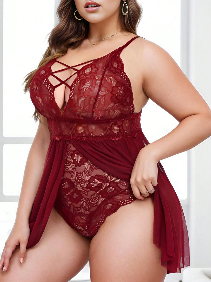 Conjunto curvy de lencería de encaje con tirantes cruzados y liguero